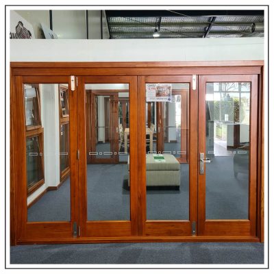 Cedar Timber Clear Glass 4 Panel Bi Fold Stacking Door in showroom