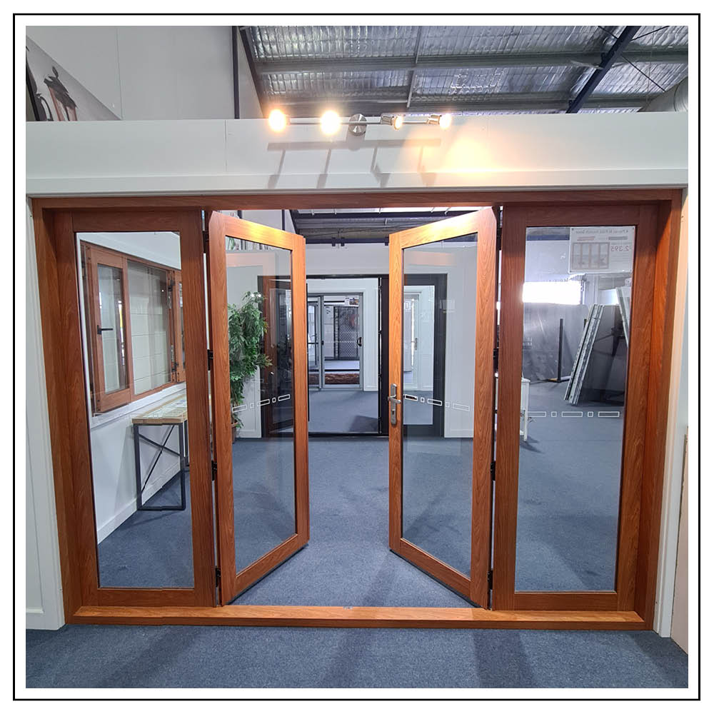 Aluminium timber effect 4 panel bi fold french doors centre panels open in showroom